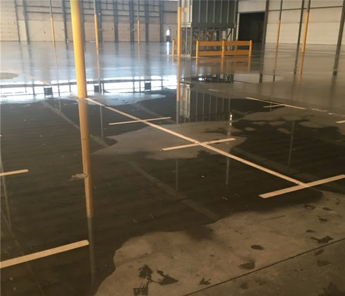 Empty warehouse with standing water